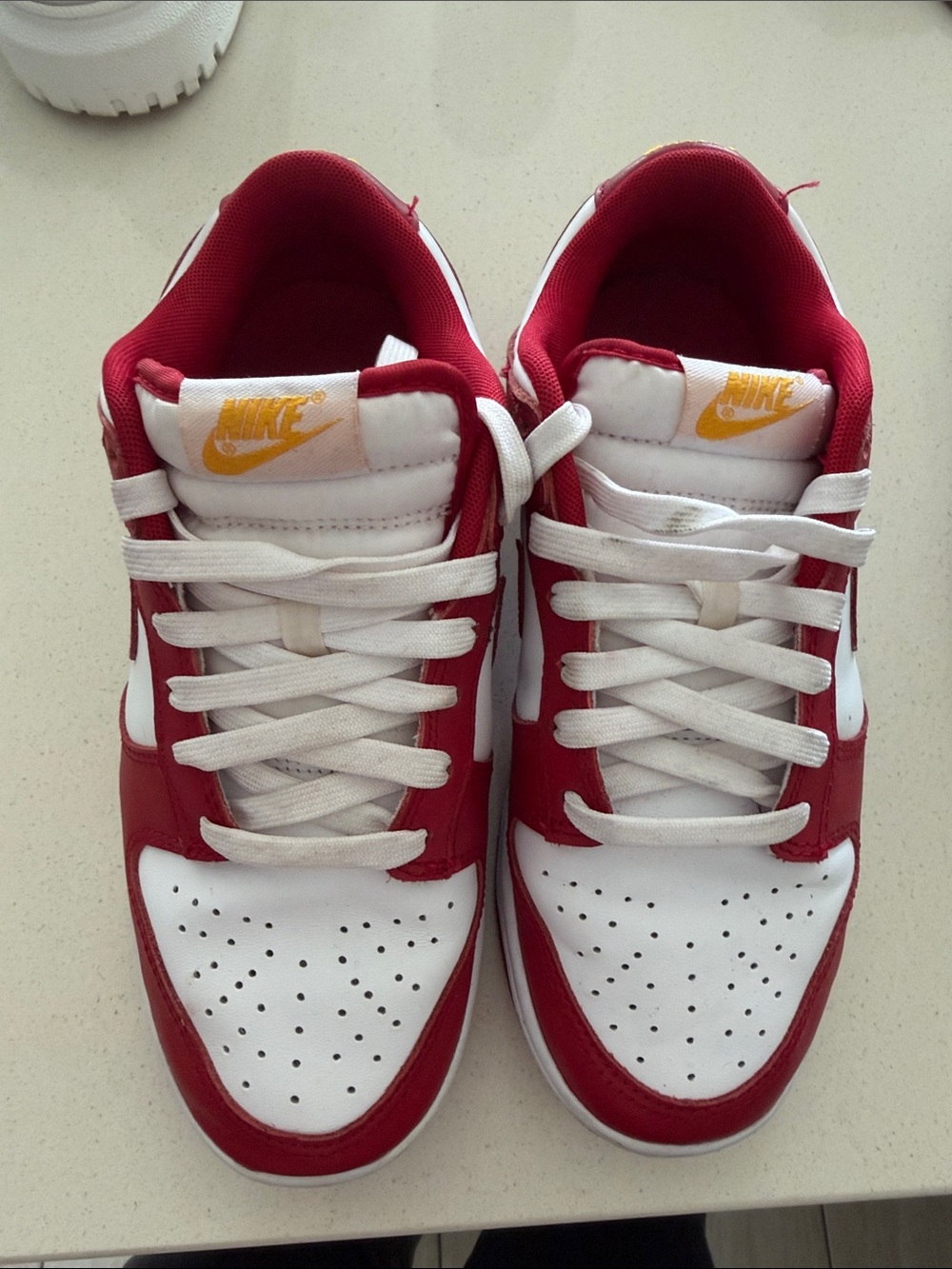 Nike Red and White Low-Top Sneakers with Yellow Tongue Logo